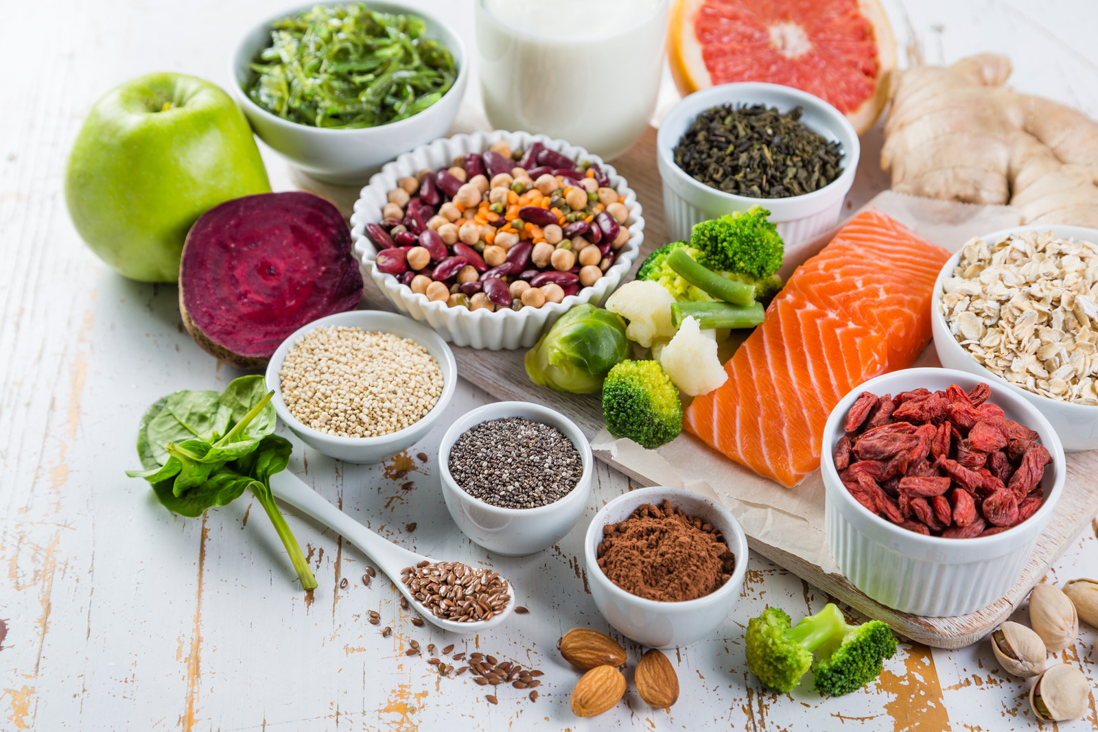 Selection of superfoods on rustic background, copy space
